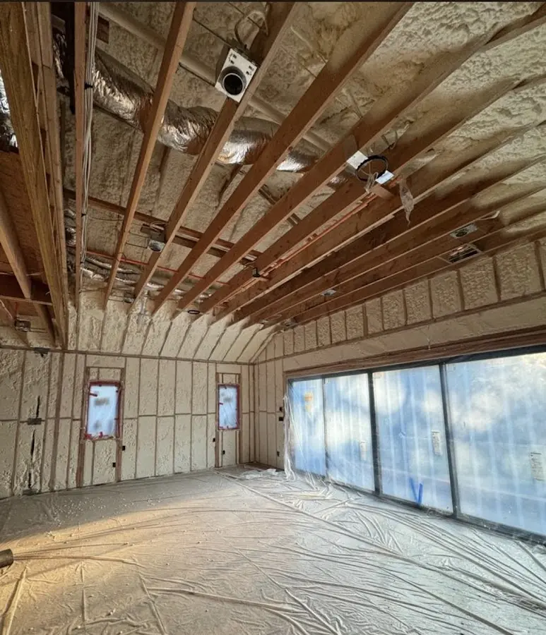 Interior walls and ceiling insulated with spray foam during new construction in Keller